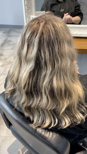 Blonde hair being styled in the salon