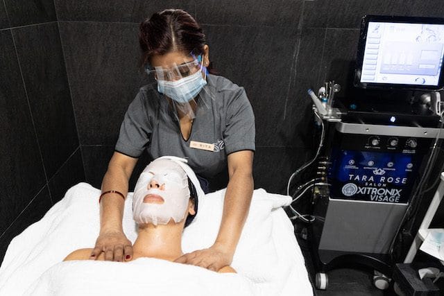 A machine-assisted facial treatment at Tara Rose
