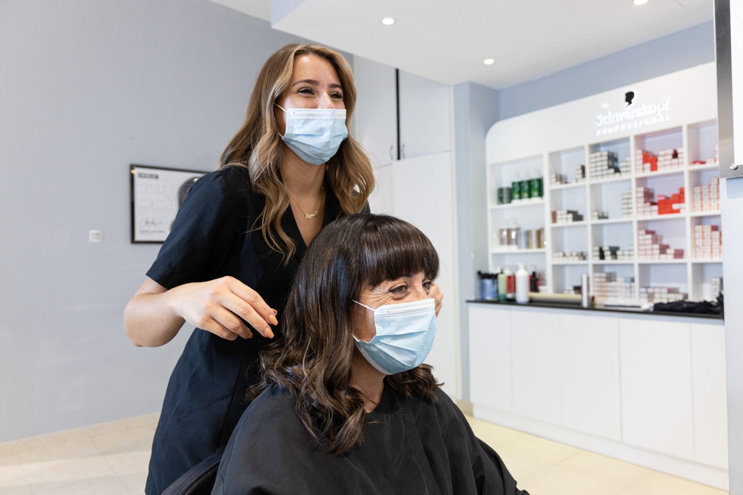 A stylist consulting with a client at Tara Rose