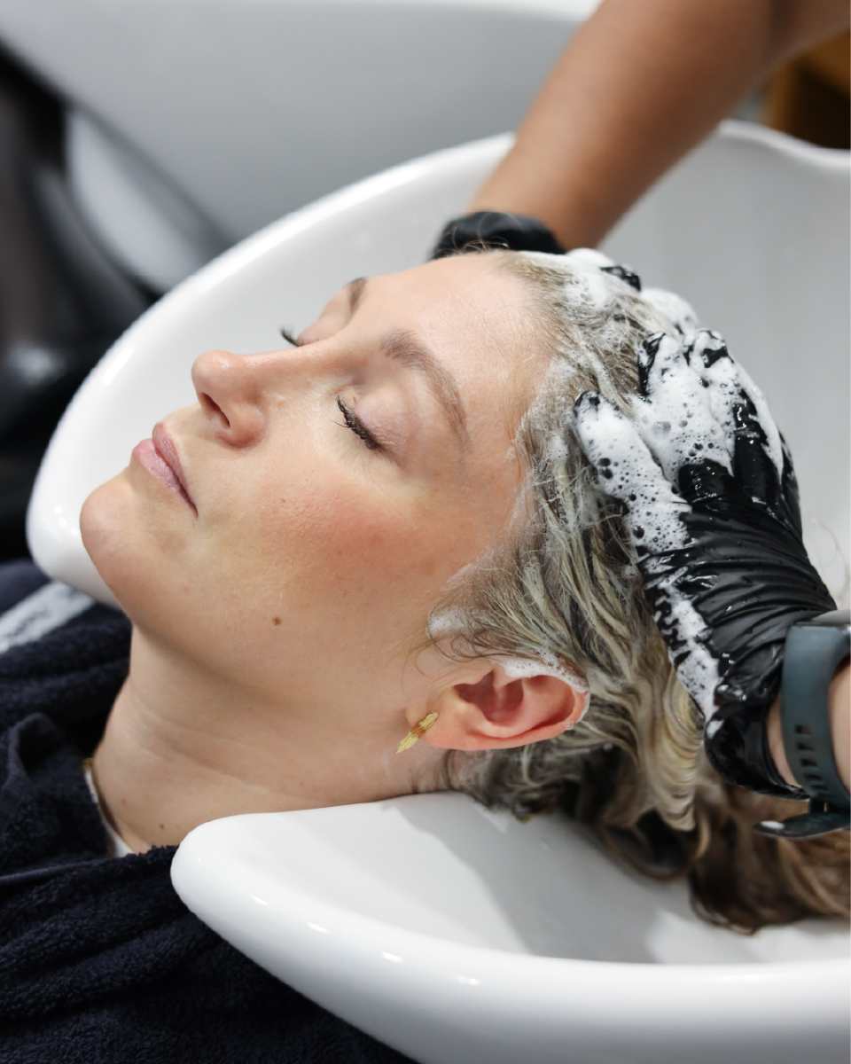 Hair being washed at the basin in a Tara Rose salon
