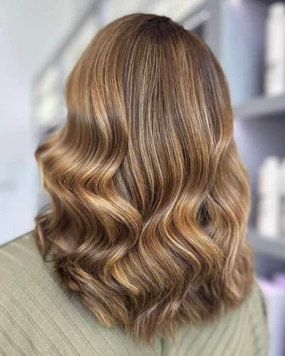 Brunette hair with soft waves, styled at Tara Rose