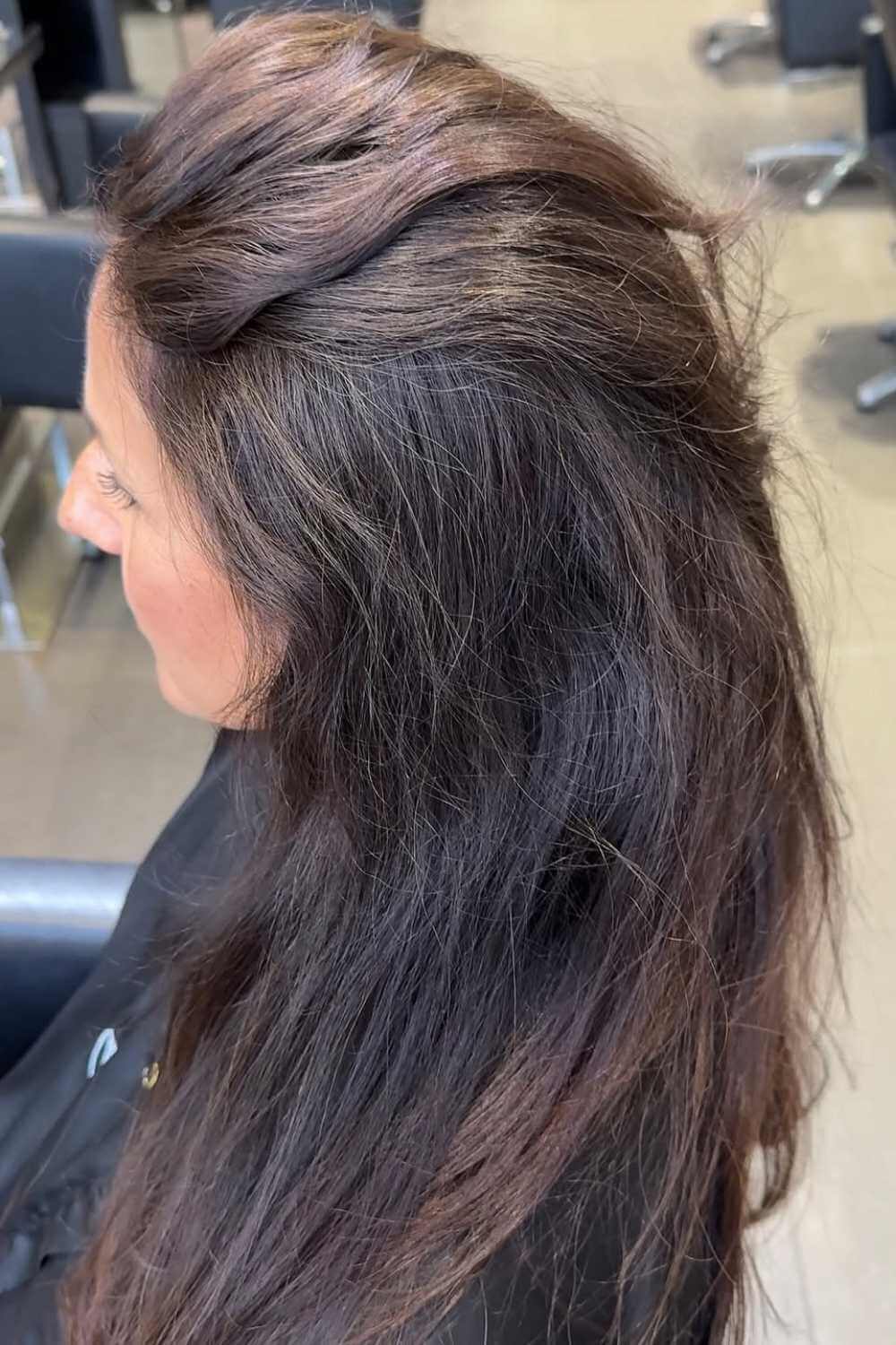 Glossy dark brunette hair with loose waves