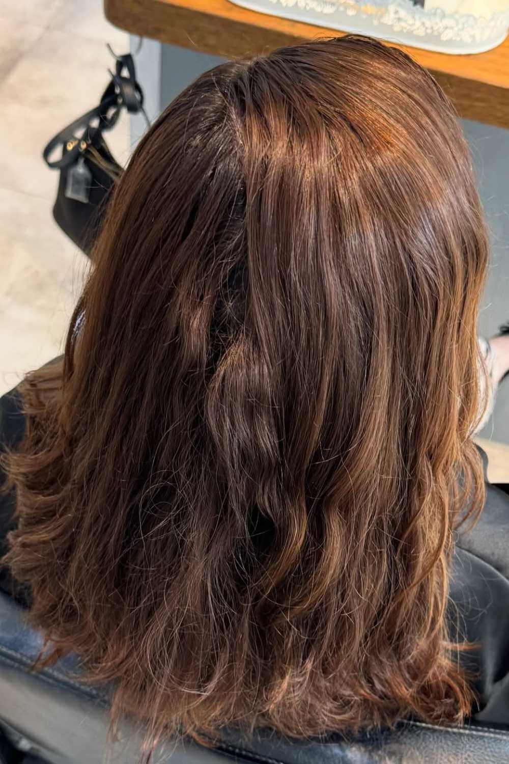Caramel balayage through brunette hair
