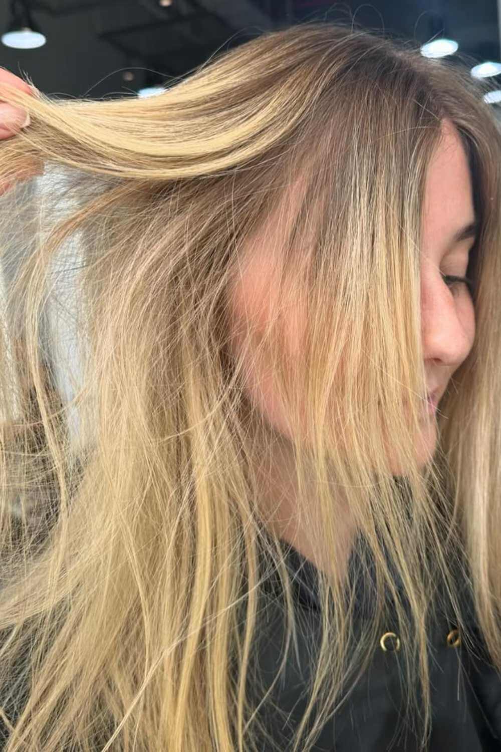 Blonde balayage with a lived-in dark root