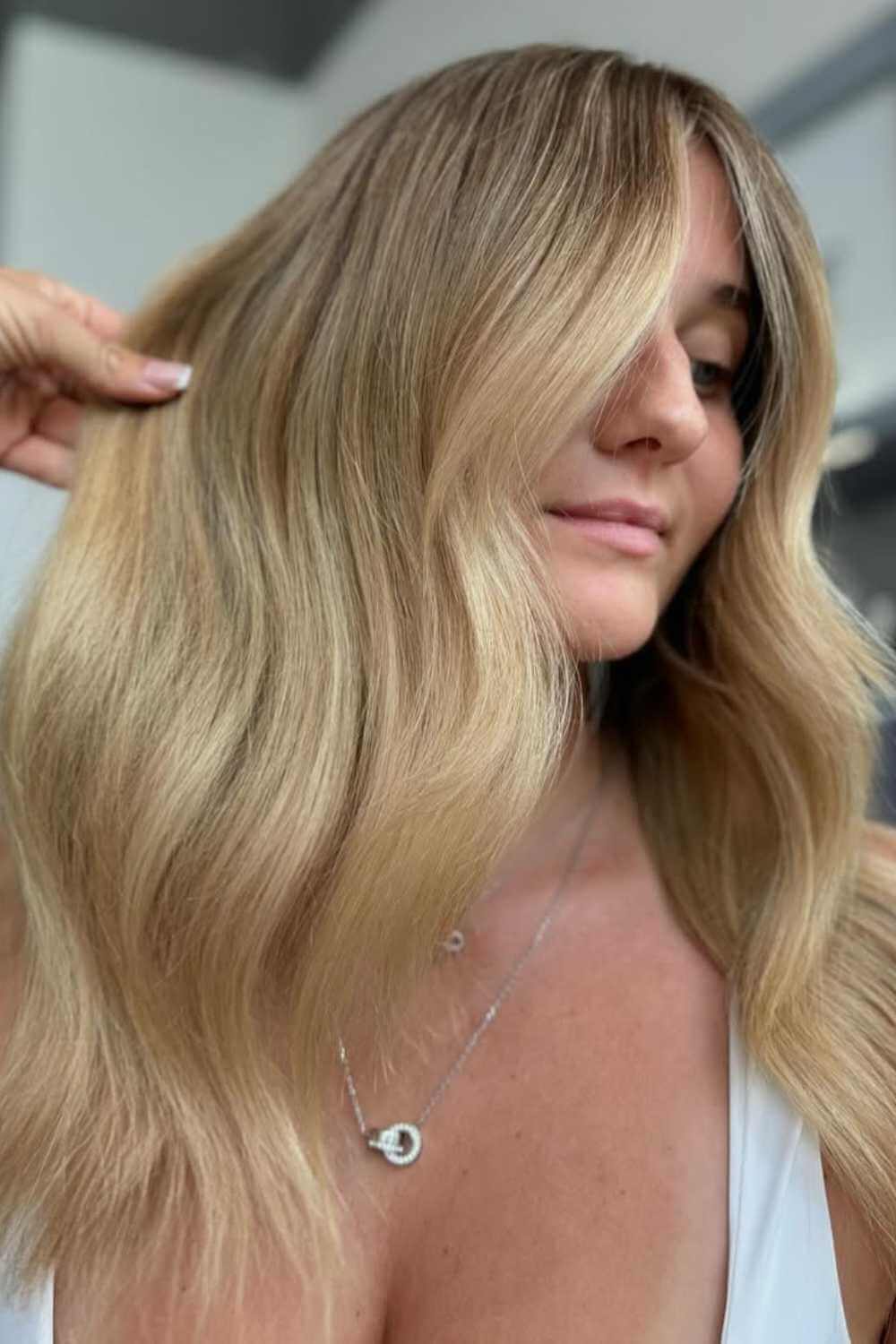 Golden blonde balayage with a soft grow-out