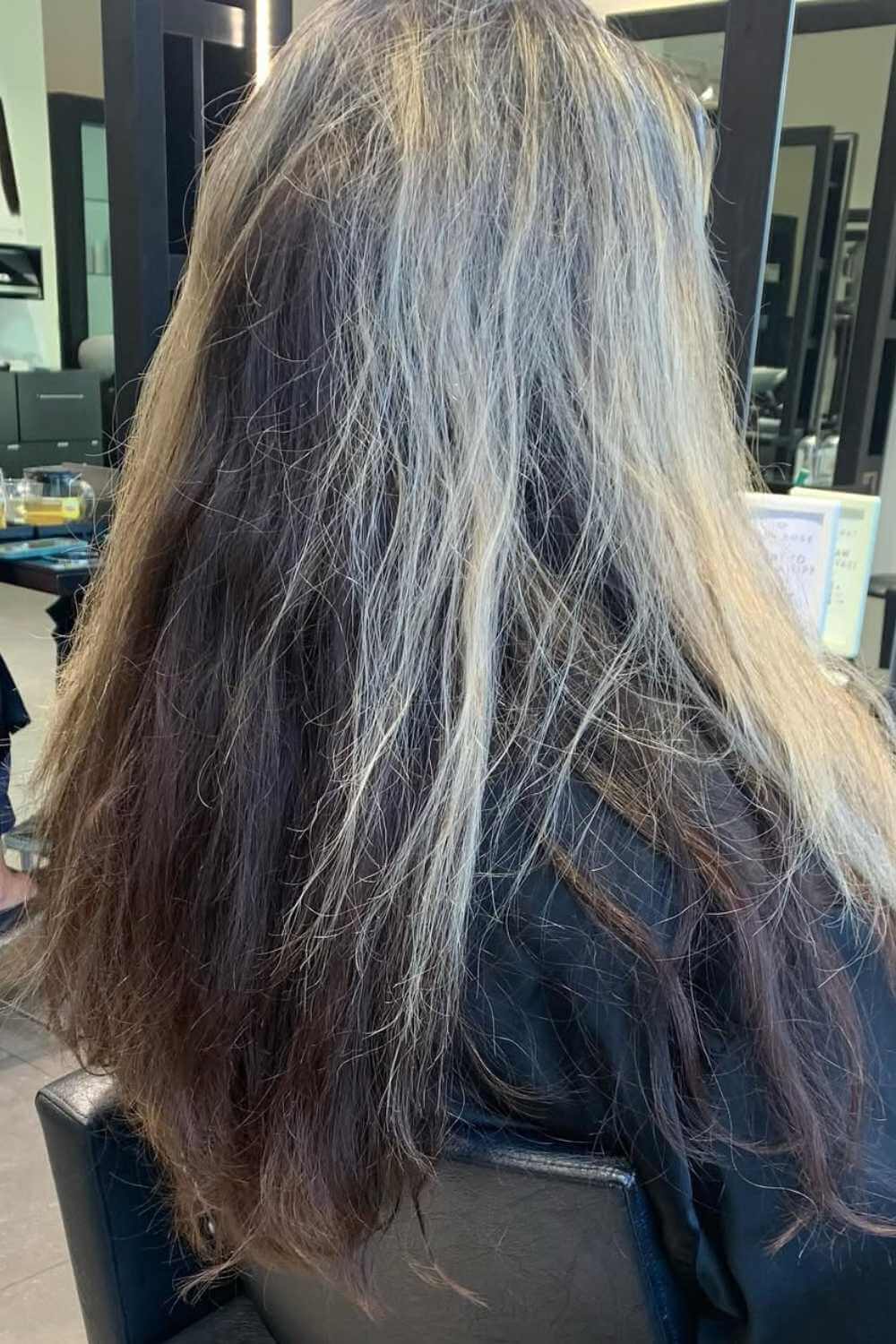 Long hair lightened from dark to blonde through the lengths