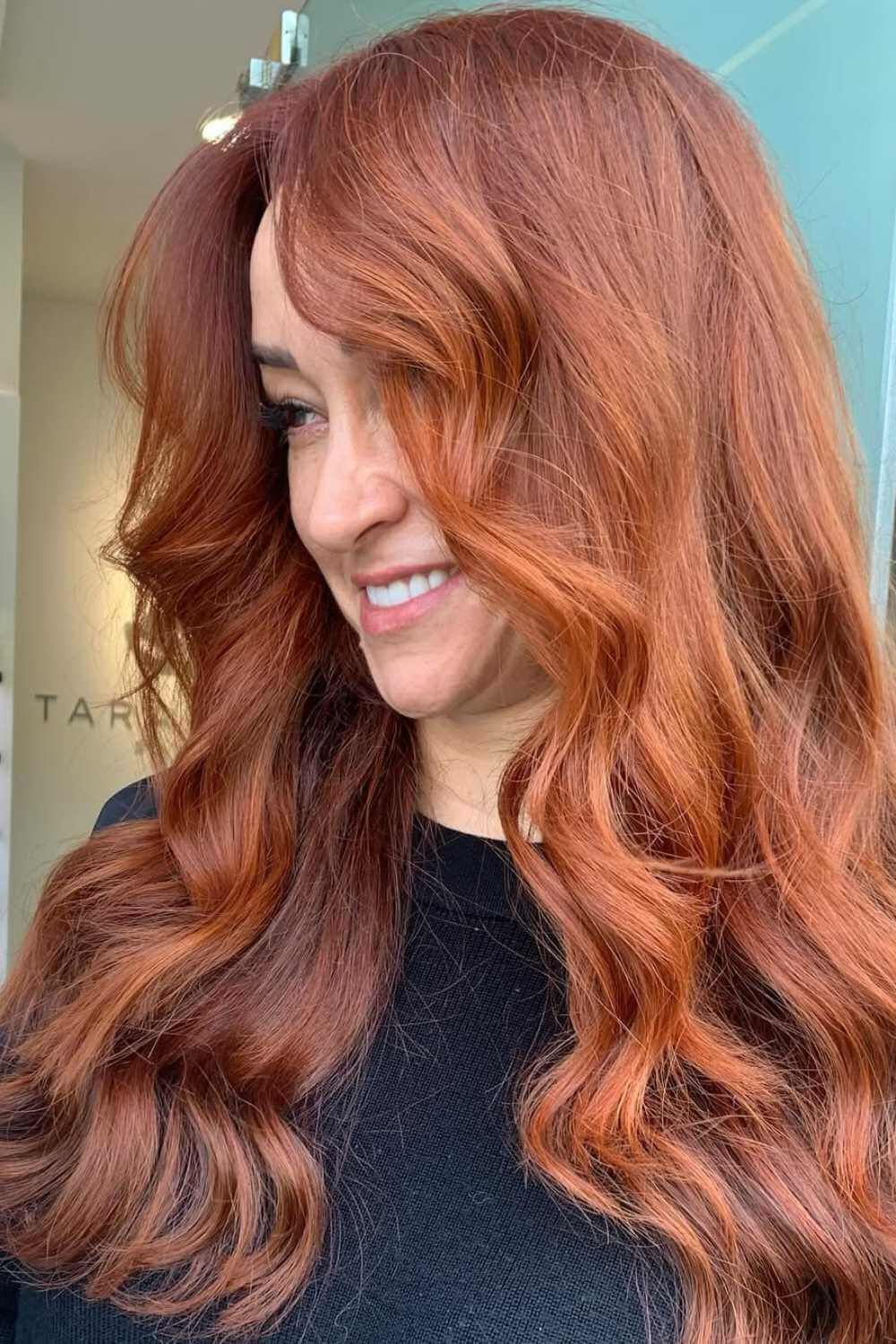 Vivid copper red hair colour with full waves