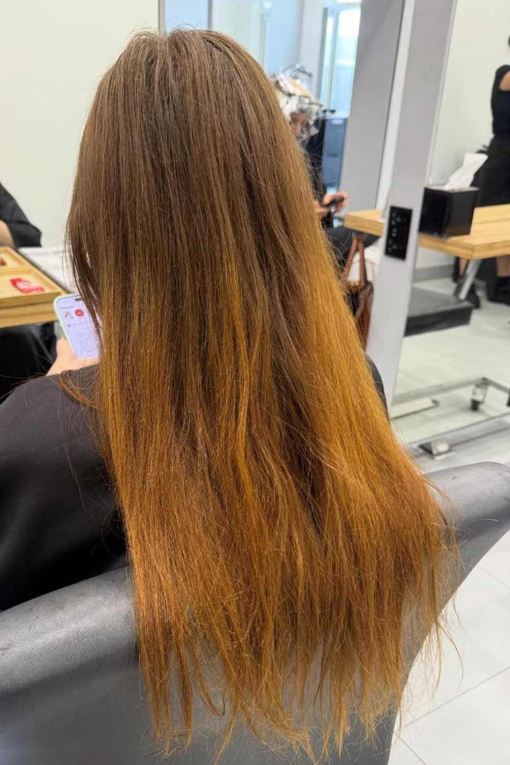 Long golden copper hair, smoothed straight